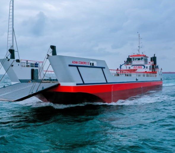 A ferry with a bow loading ramp underway on the water